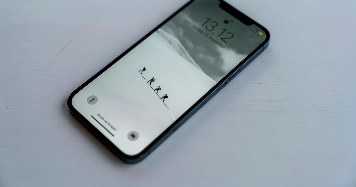 iPhone lying on a white table, ready for ViviMate on iOS