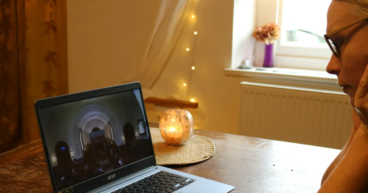 Person watching a video on a laptop at home — ViviMate on Mac and PC