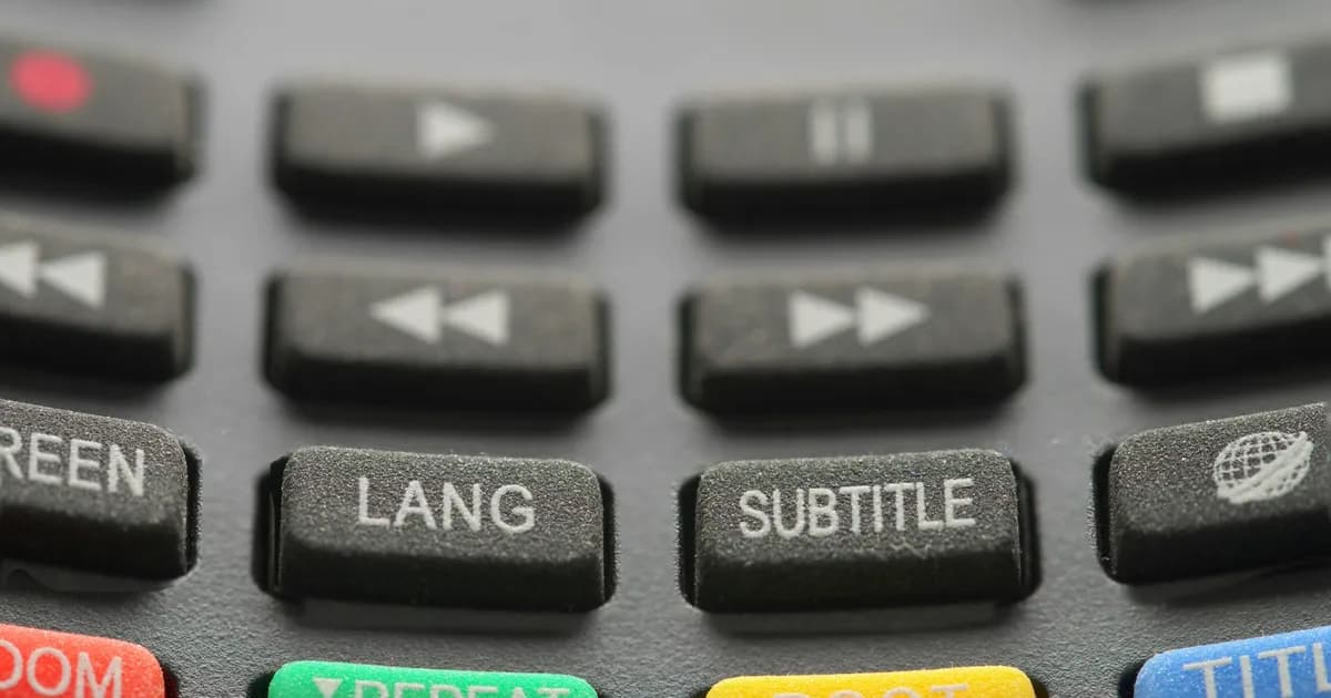 Close-up of TV remote buttons used to browse the ViviMate EPG guide